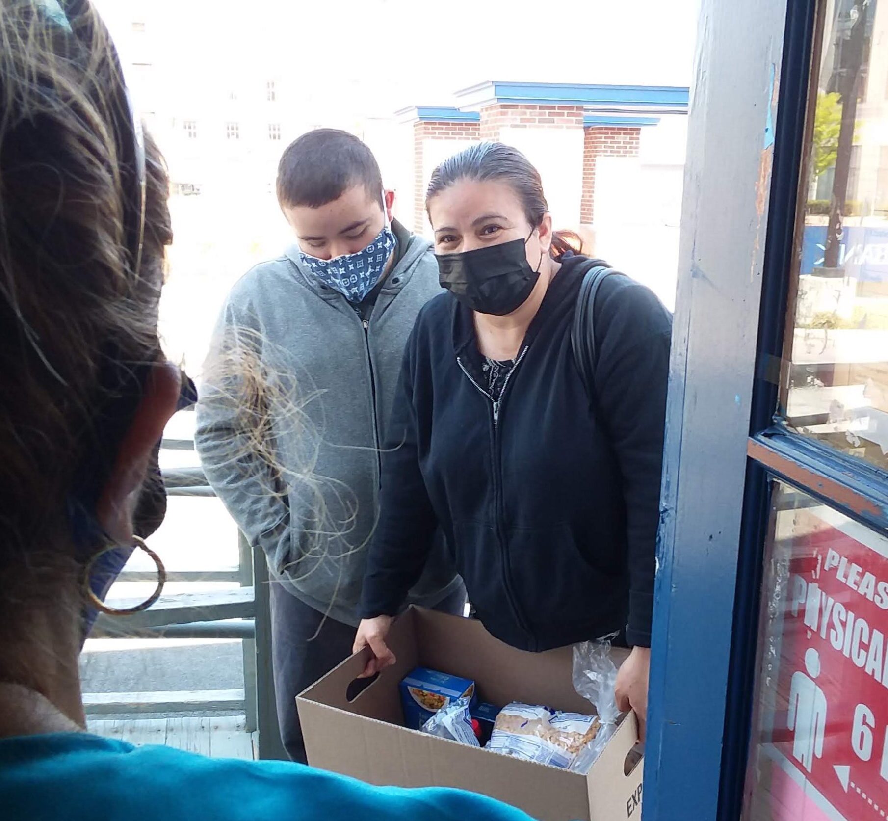 mother and son picking up food